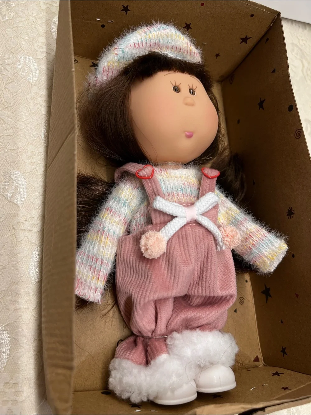 New, Mia Doll with Brown Hair Wearing a Pastel Sweater and Pink Overalls.